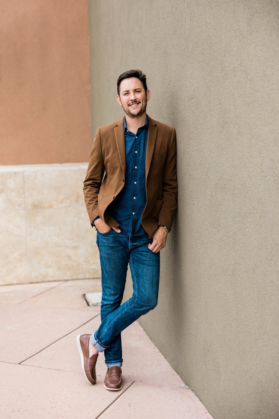 Man in Suede Business Jacket and Denim Pants